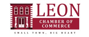 Logo for the Leon Chamber of Commerce featuring a brick building illustration and the text "LEON Chamber of Commerce—Small Town, Big Heart" in maroon and white.